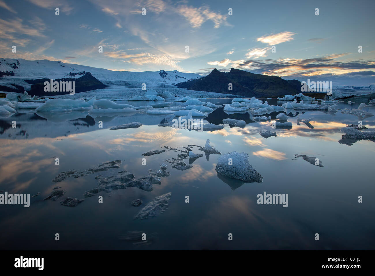 Arctic nature scenery of Jokulsarlon, glacier lagoon in Iceland at night with ice melting and floating in water. Stock Photo