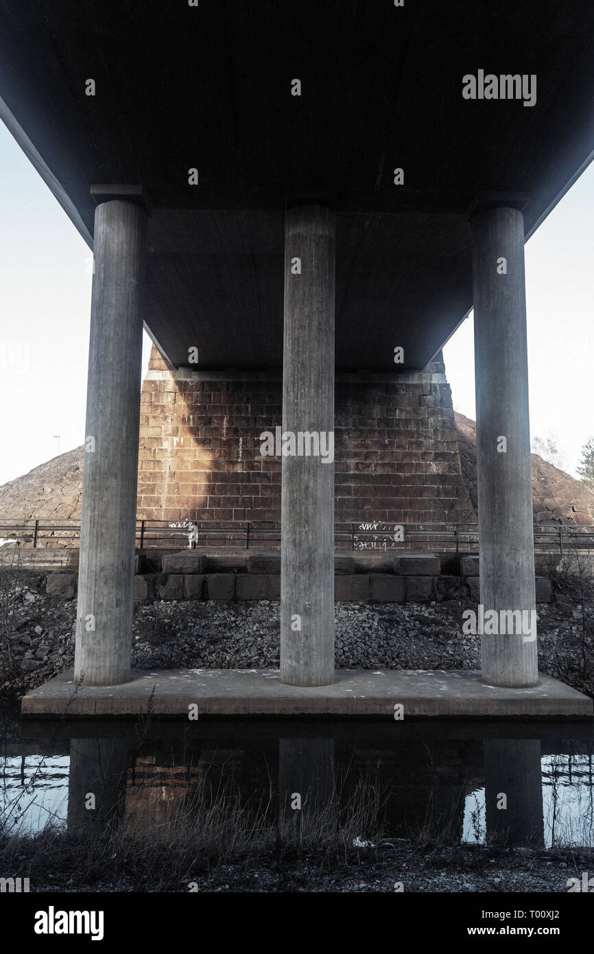 concrete bridge columns, the reflection in the river Stock Photo