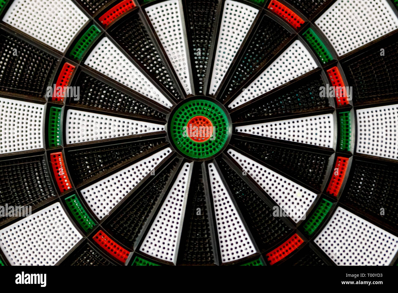 Closeup dartboard with black, white, red and green colors Stock Photo