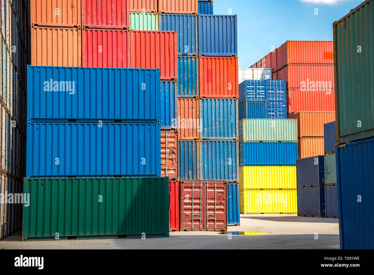 several-stacks-of-colorful-containers-in-the-industrial-port-stock