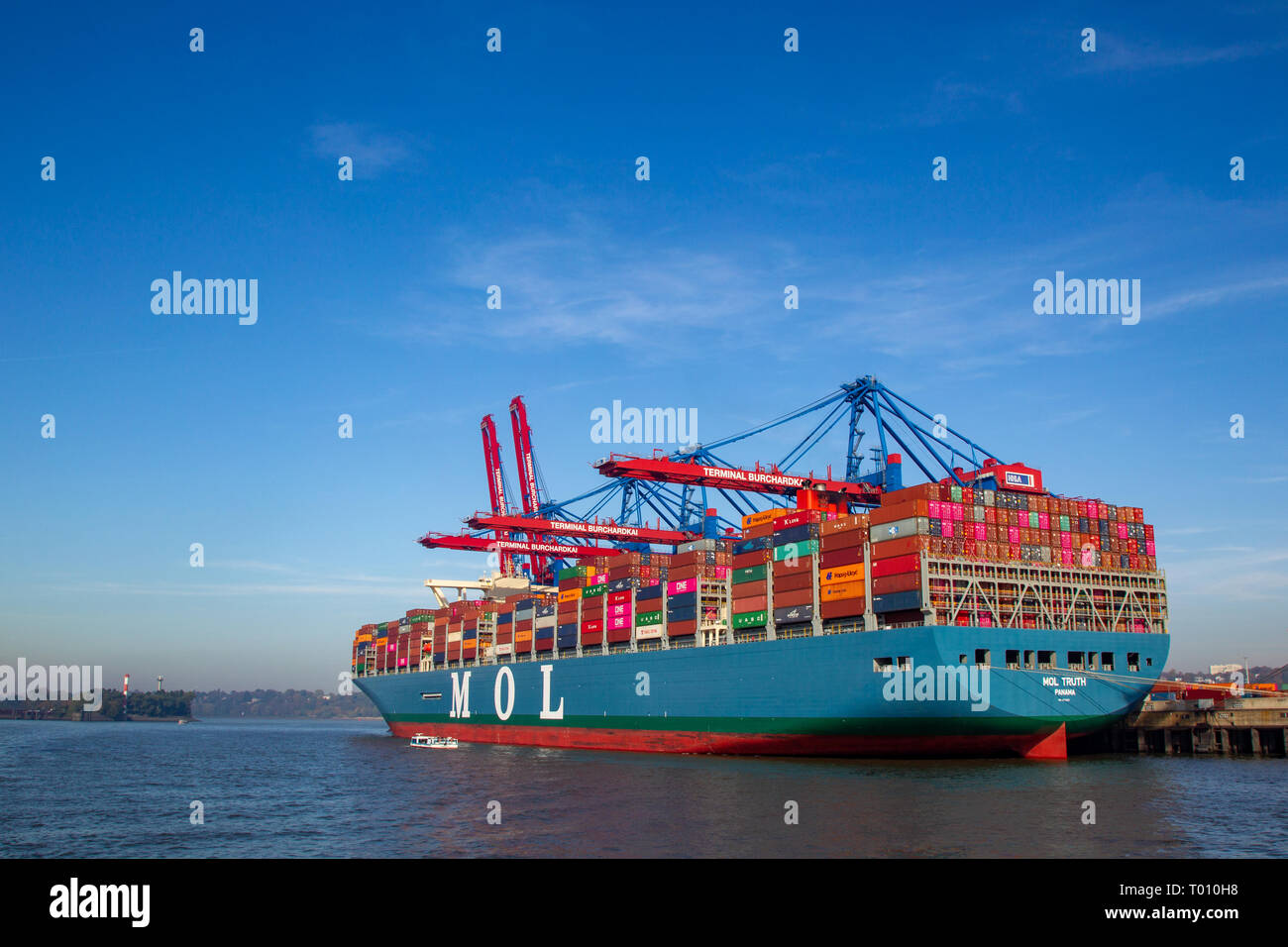 The MOL Truth, one of the biggest container ships of the world, at Burchardkai in the harbour of Hamburg, Germany. Stock Photo