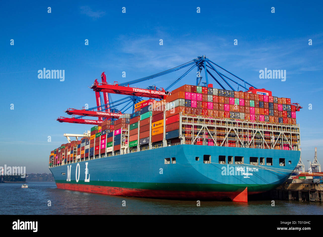 The MOL Truth, one of the biggest container ships of the world, at Burchardkai in the harbour of Hamburg, Germany. Stock Photo