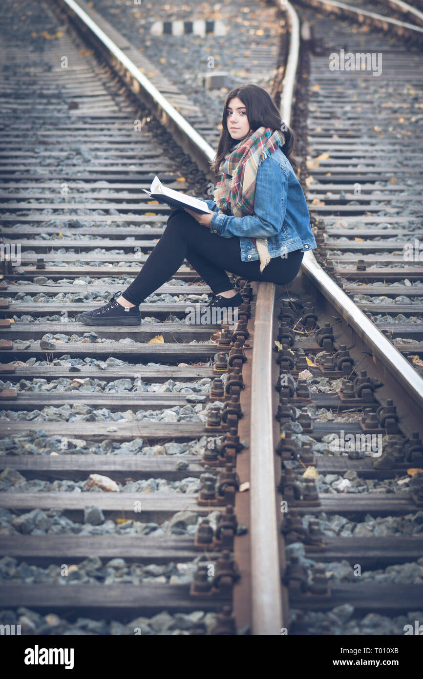 Beautiful Girl On Train Tracks High Resolution Stock Photography and