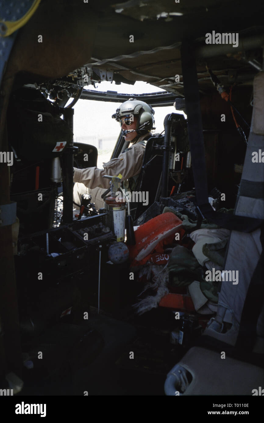 29th October 1993 The pilot at the controls of a U.S. Army Sikorsky UH-60 Black Hawk helicopter, shortly before taking off from UNOSOM HQ in Mogadishu, Somalia. Stock Photo