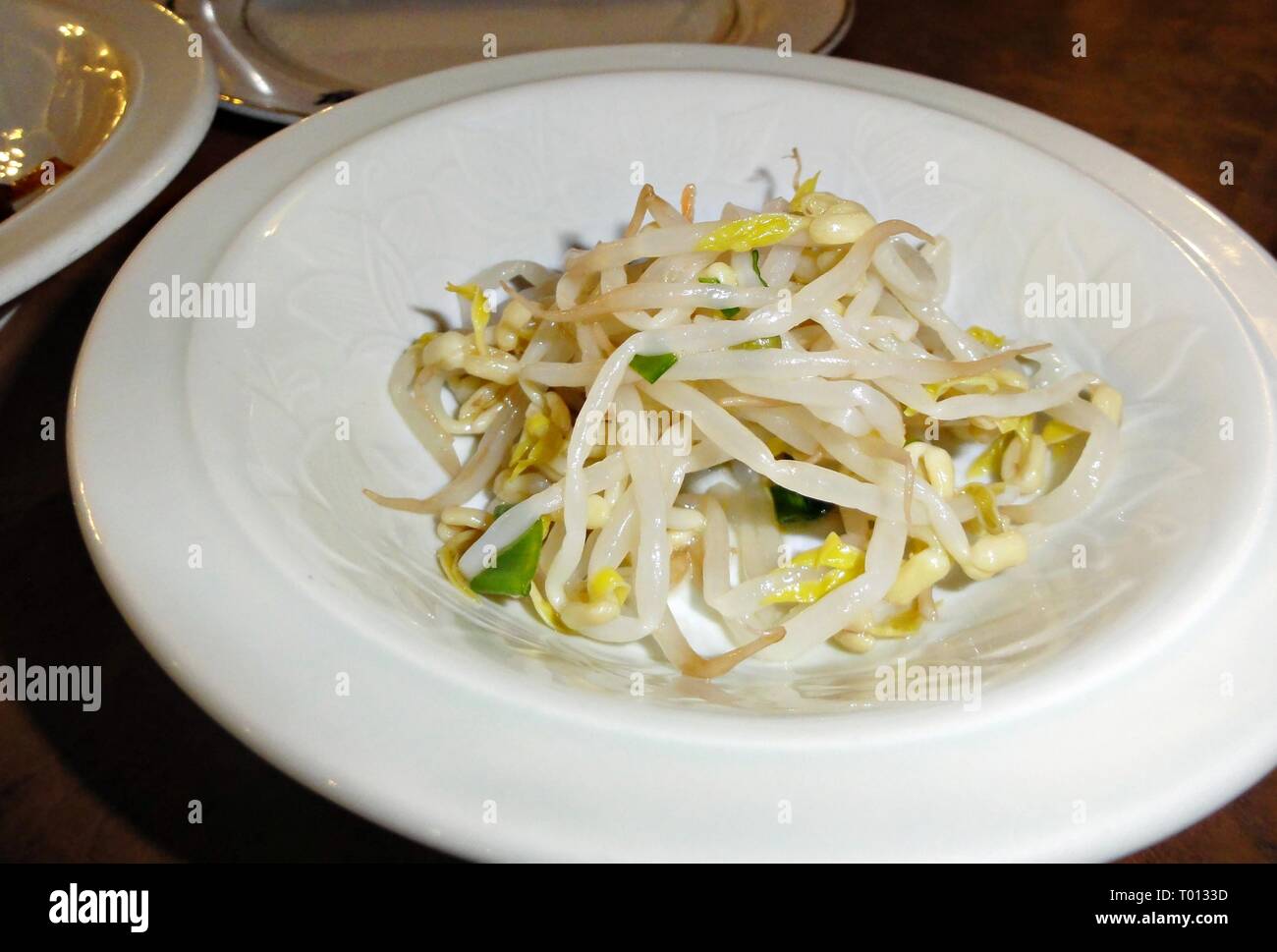 Monggo bean sprouts appetizer in white plate Stock Photo Alamy