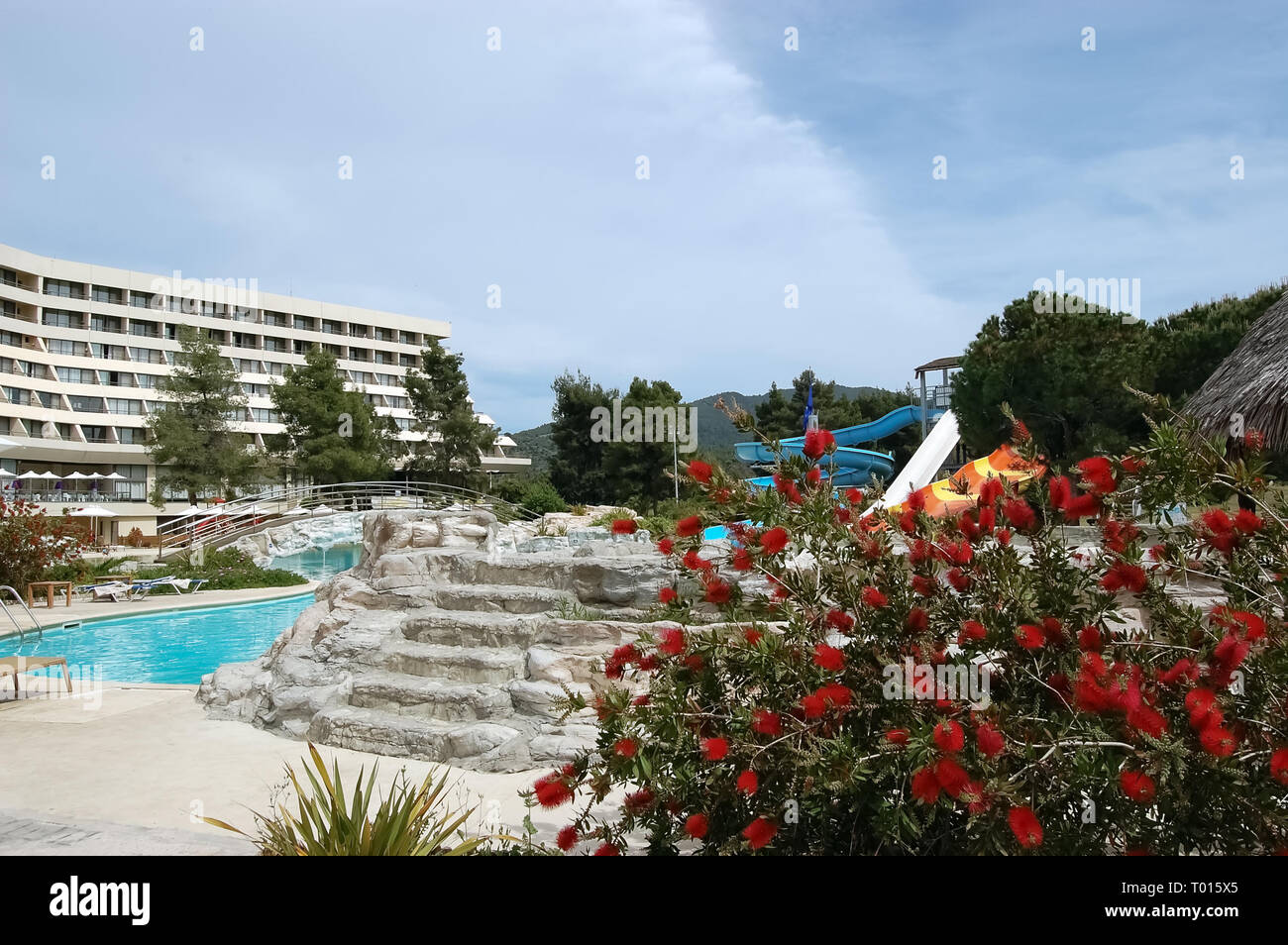 Neos Marmaras, Greece - May 07, 2012: View of the territory and swimming pool with water slides of a modern high-class hotel,  Sithoniа peninsula. Stock Photo