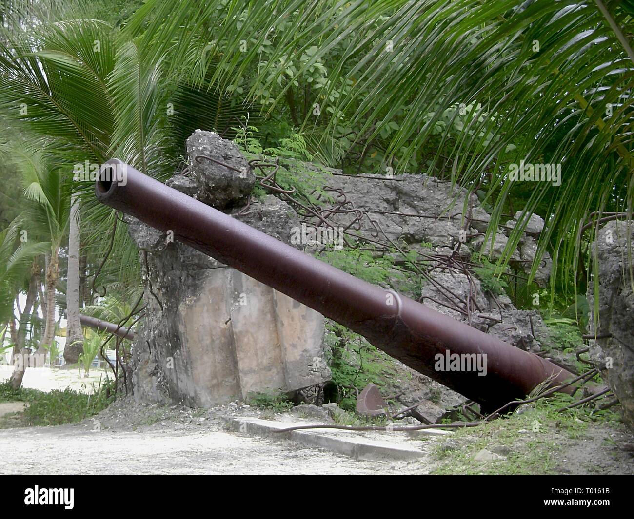 Side view of the relics of a World War 11 Japanese cannon preserved at Managaha Island, Saipan, Northern Mariana Islands Stock Photo