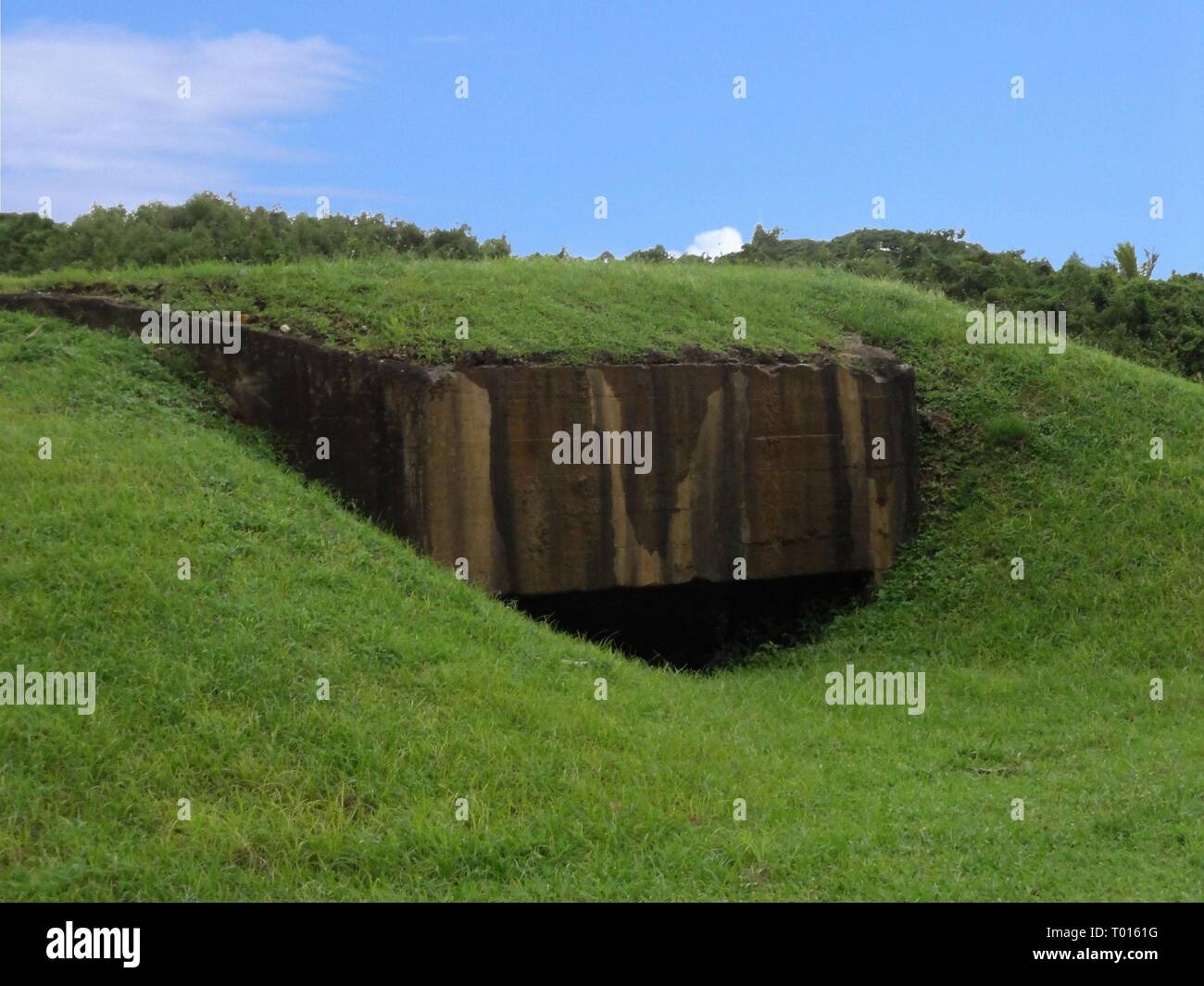 Japanese pillbox at the Coral Ocean Point is just one of the many relics left during the World War 11 Stock Photo