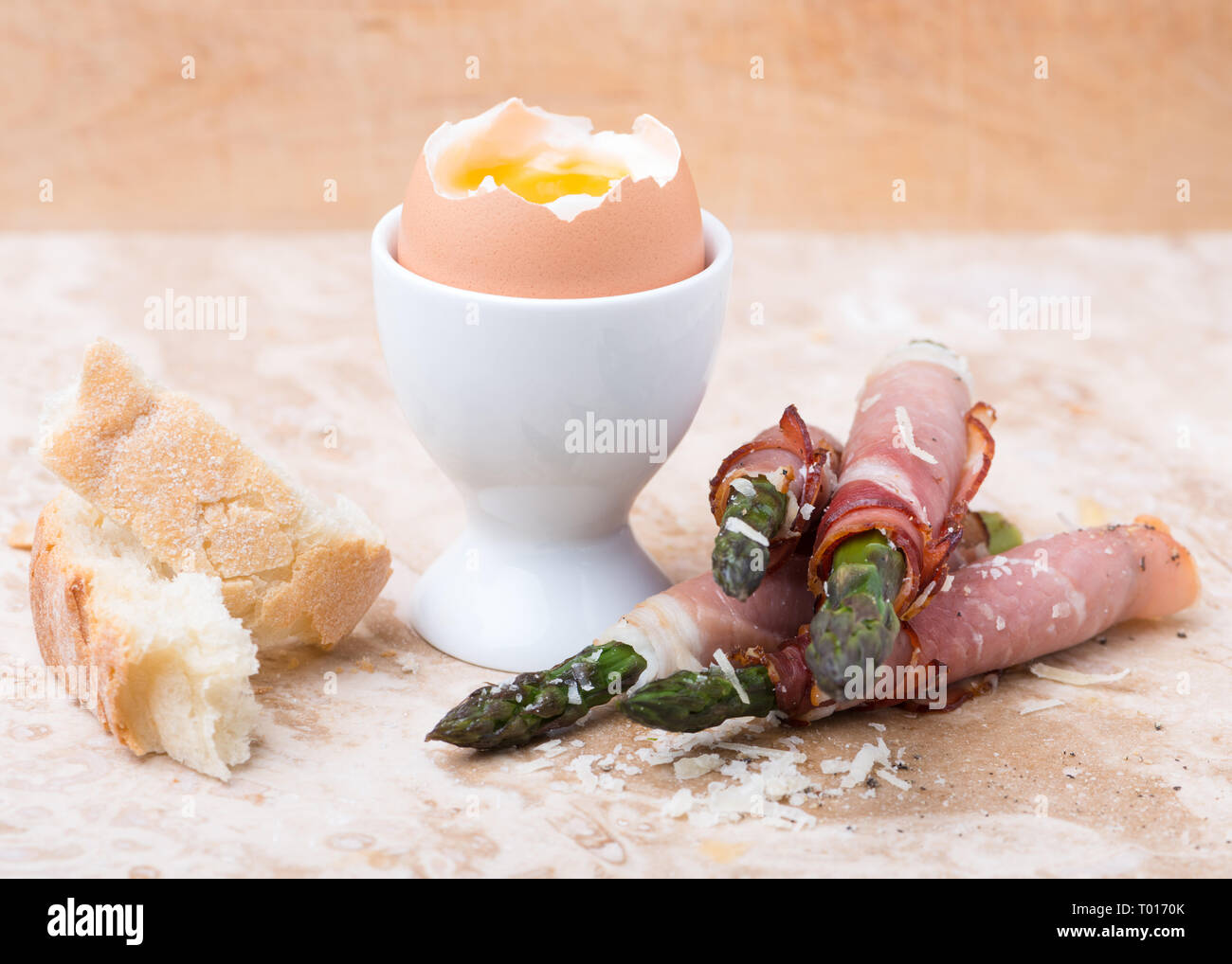 breakfast with soft boiled egg and asparagus wrapped in Parma ham Stock Photo Alamy