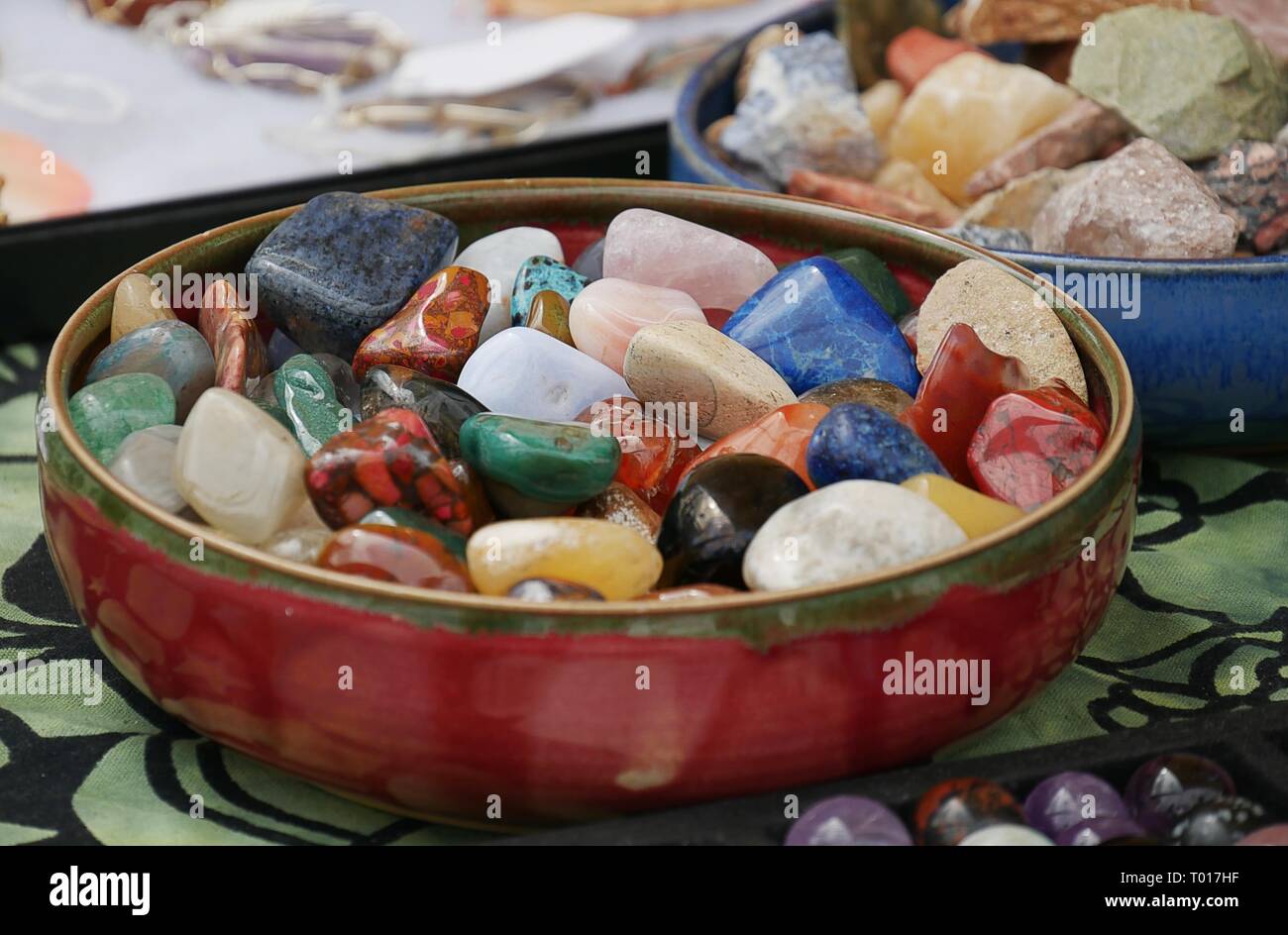 Colorful semiprecious stones and gemstones in a round bowl Stock Photo