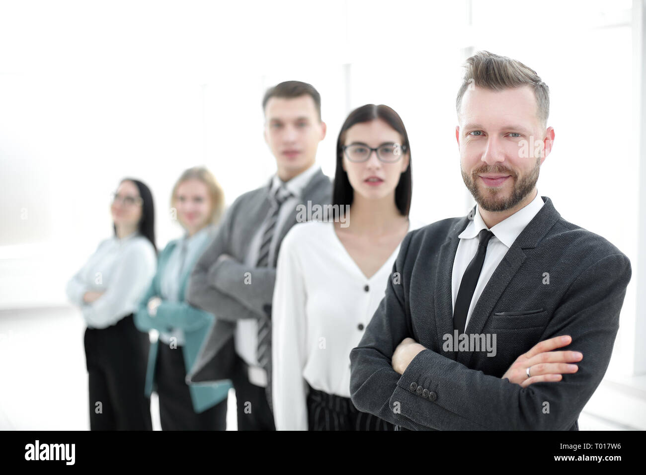confident businessman standing in front of his business team Stock ...