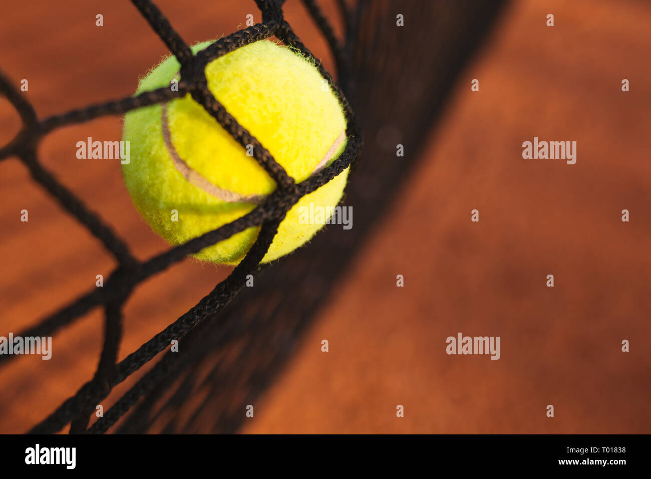 Tennis ball hitting the tennis net Stock Photo Alamy