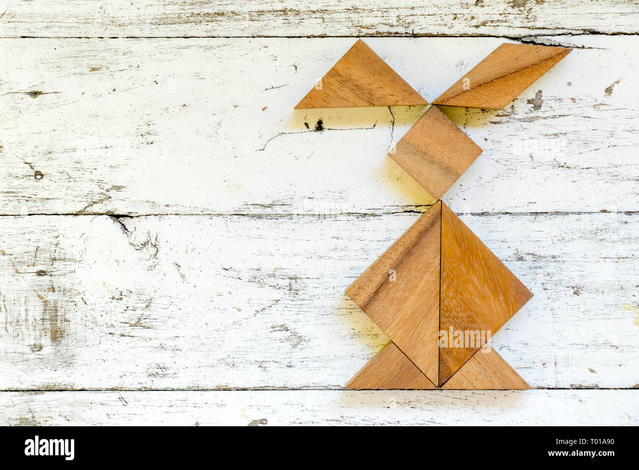 Rabbit Tangrams Example Tangram puzzle in rabbit shape on old white wood background Stock Photo ...