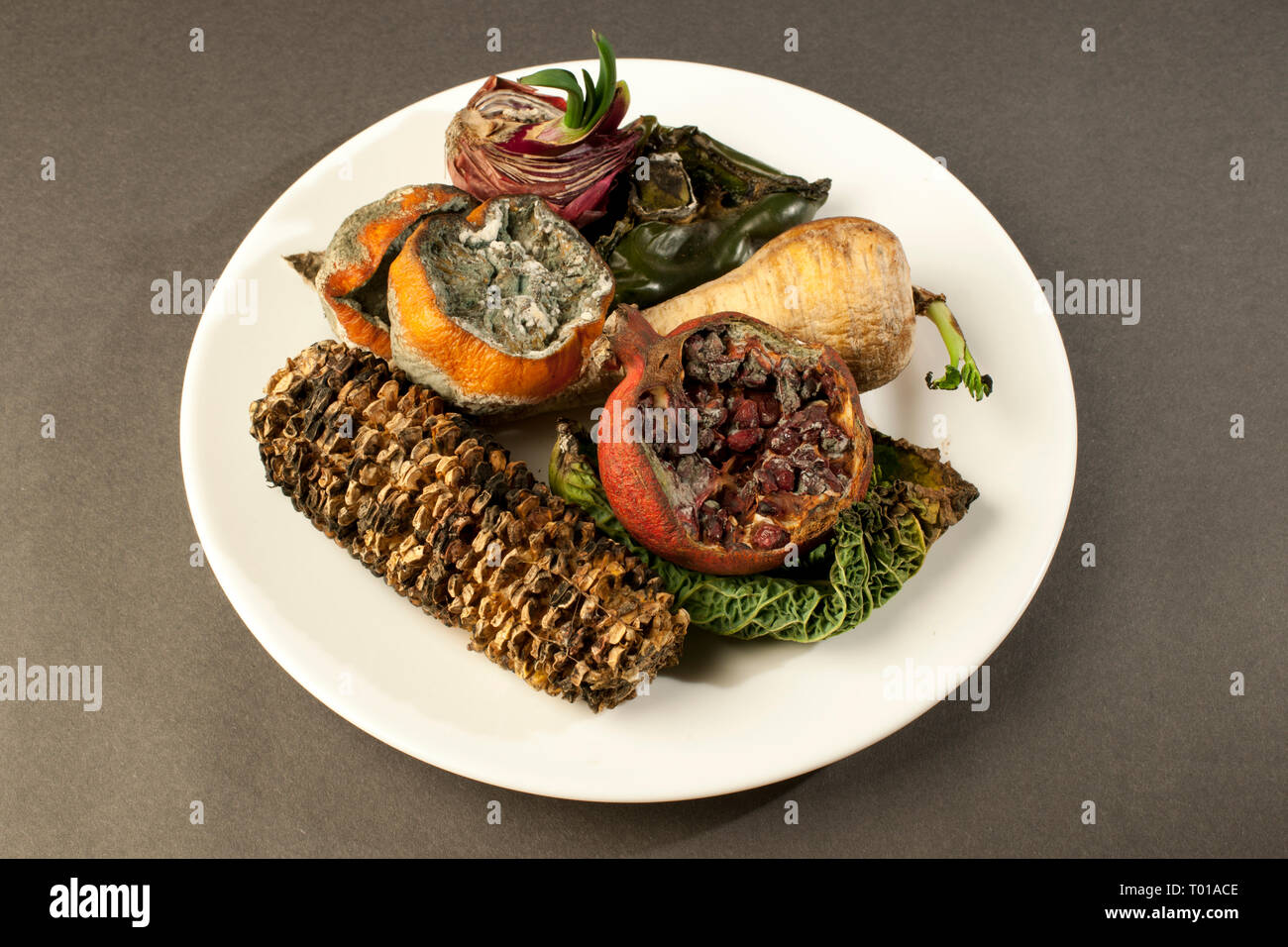 Rotting Fruit and Vegetables on a Table Top Stock Photo