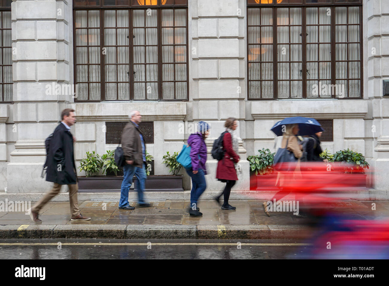 pedestrians walking on a rainy London street with motion blur Stock ...
