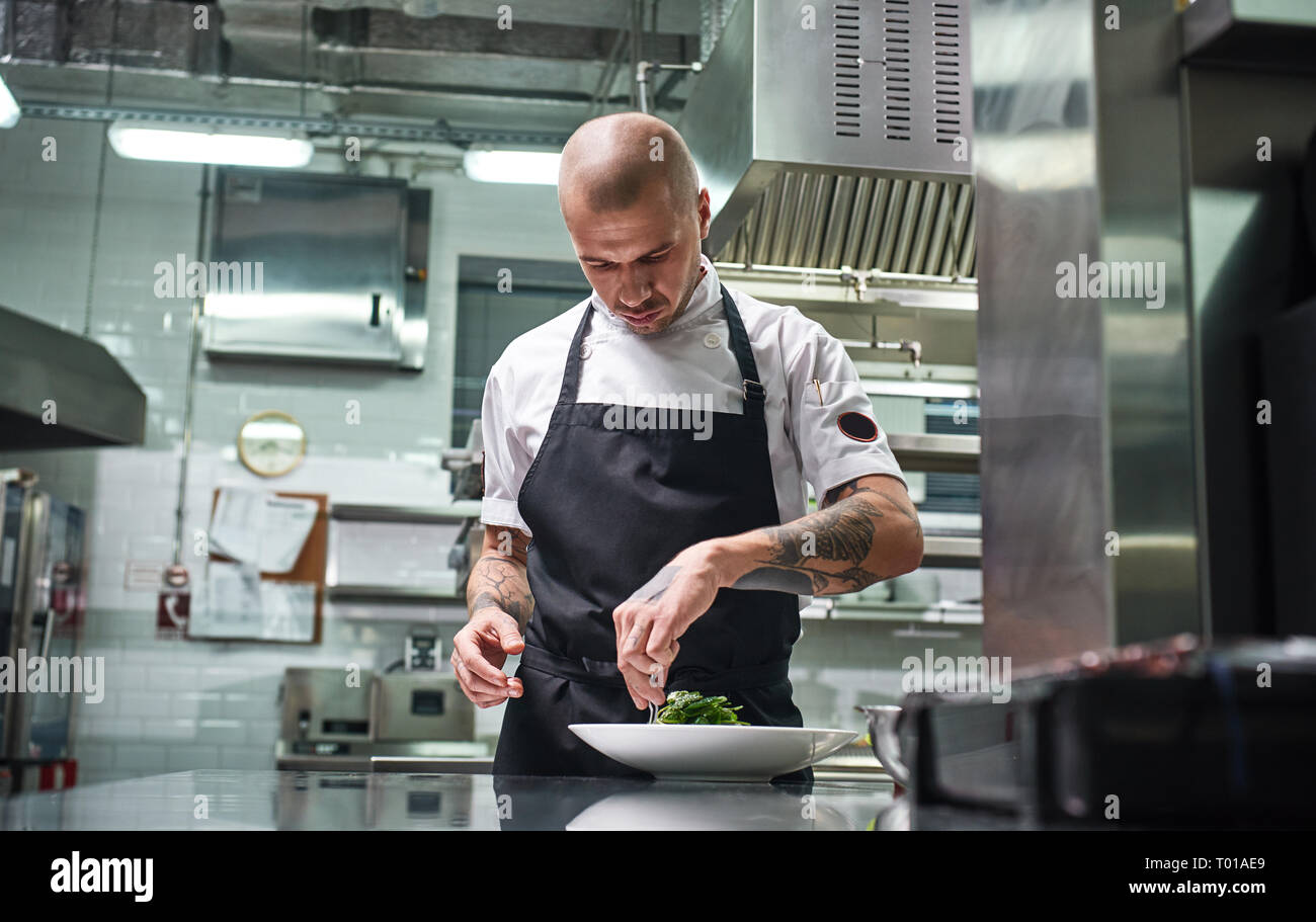 Concentrated At Work Portrait Of Handsome Professional Chef In