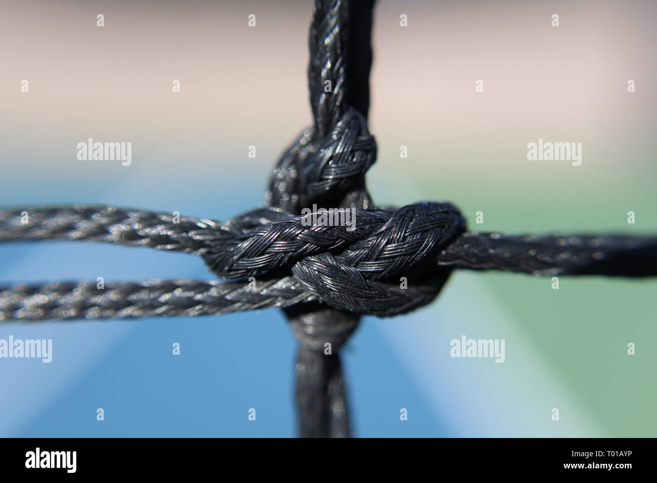 Knot in tennis netting black close up view Stock Photo Alamy