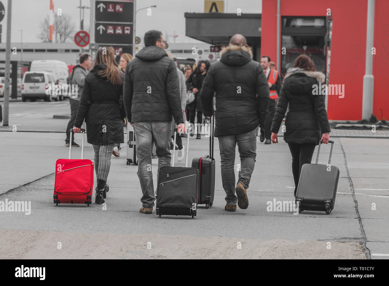 Berlin, Germany - march 2019: People with luggage walking at airport, travel concept - Stock Photo