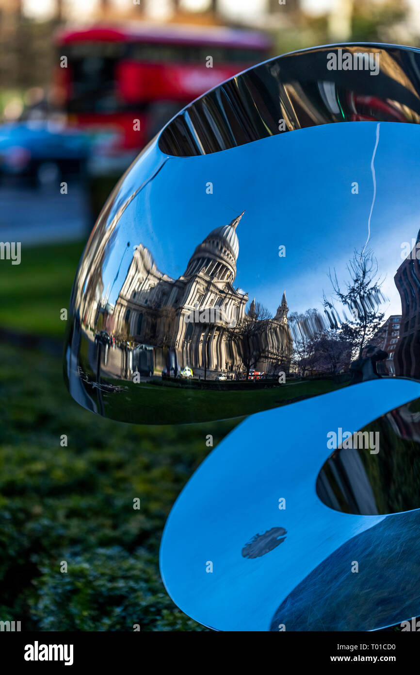 St Paul's Cathedral reflected in a modern sculpture in Carter Lane