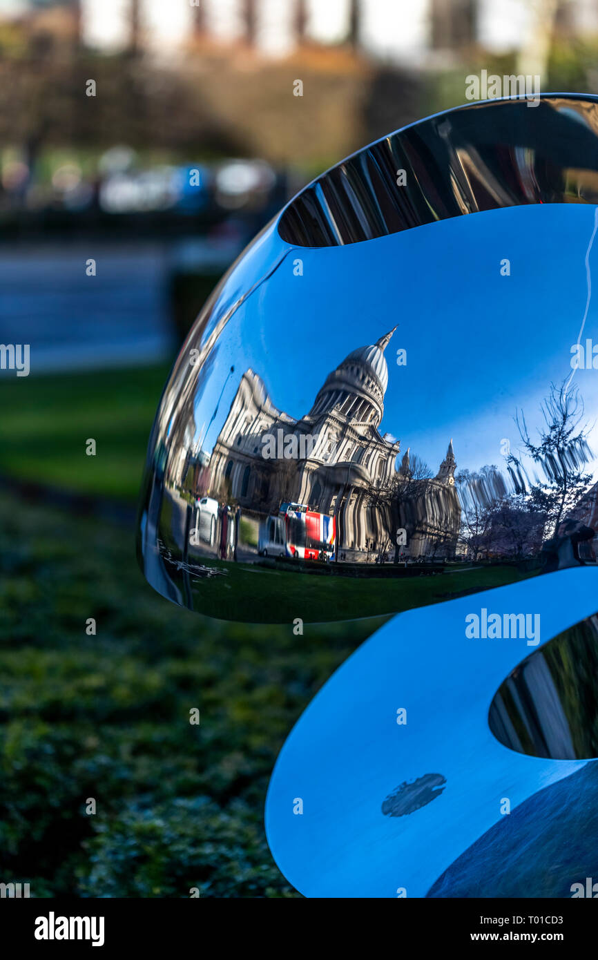 St Paul's Cathedral reflected in a modern sculpture in Carter Lane