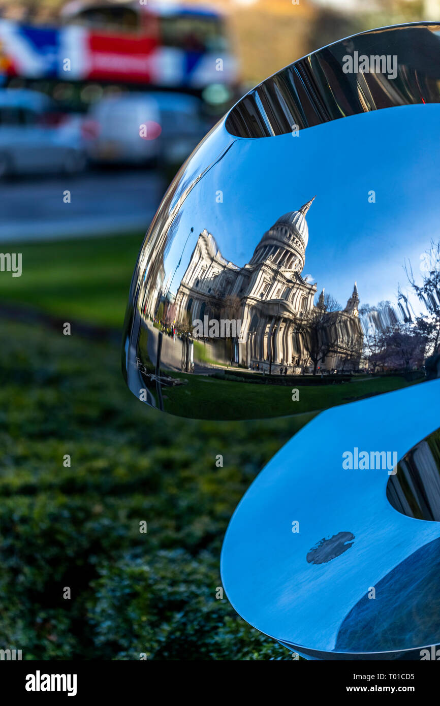St Paul's Cathedral reflected in a modern sculpture in Carter Lane