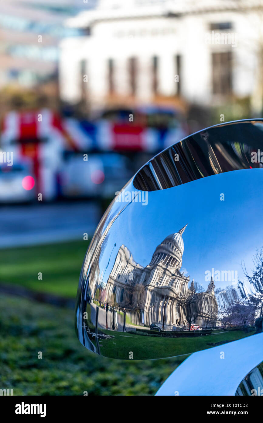 St Paul's Cathedral reflected in a modern sculpture in Carter Lane