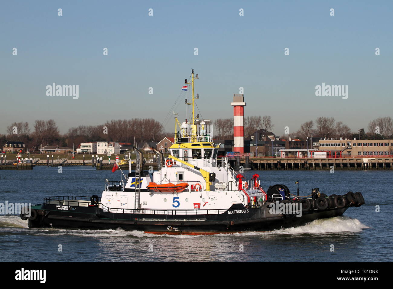 The harbor tug Multratug 5 operates on 15 February 2019 in the port of Rotterdam. Stock Photo