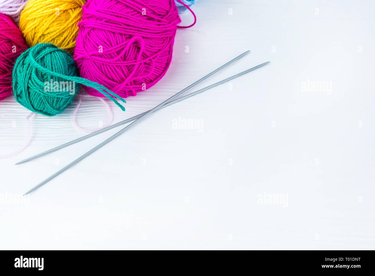 knitting ball of yarn and knitting needles on a white background Stock ...