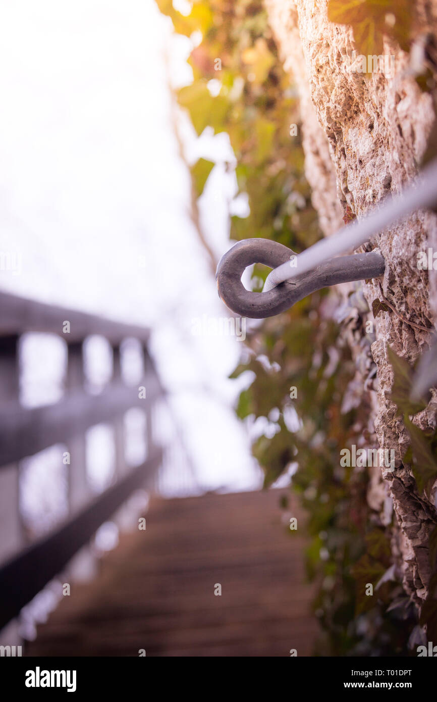 Iron piton in a rock, climbing sports Stock Photo Alamy