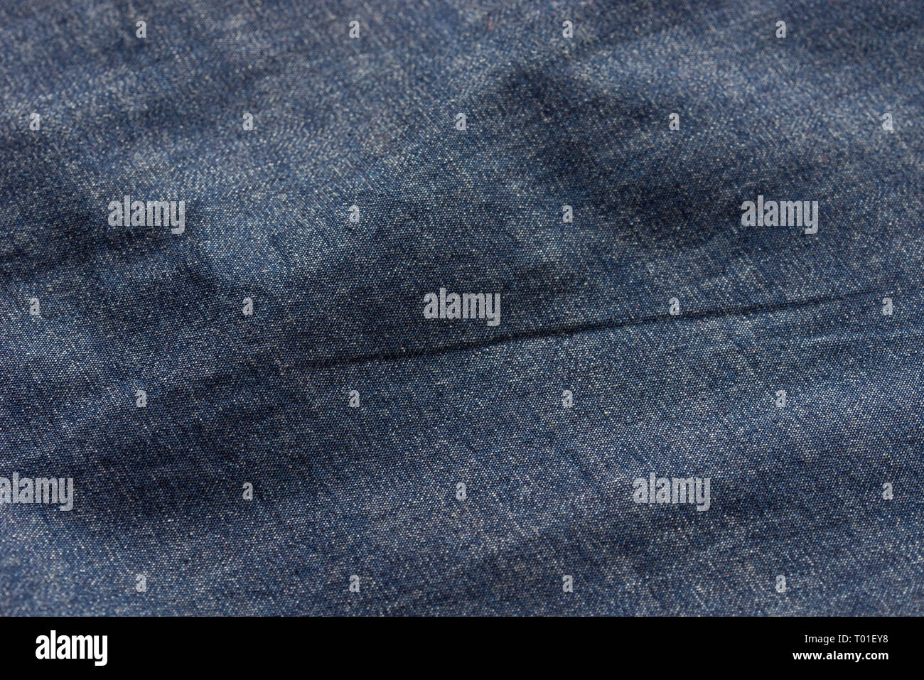 blue creased  fabric background texture selective focus Stock Photo