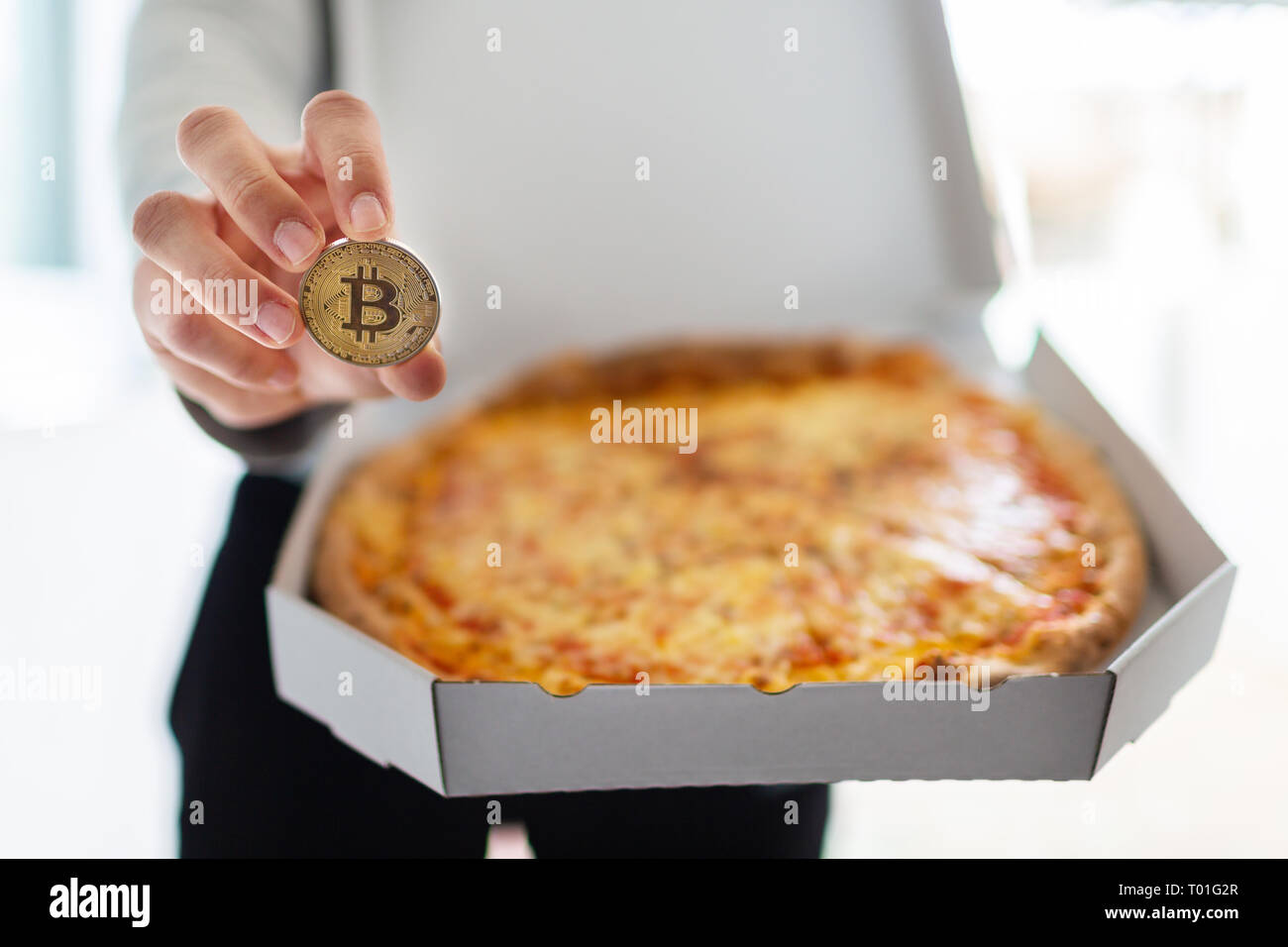Bitcoin pizza day anniversary. The first reported exchange of cryptocurrency  for a consumer product on May 22, 2010 Stock Photo - Alamy