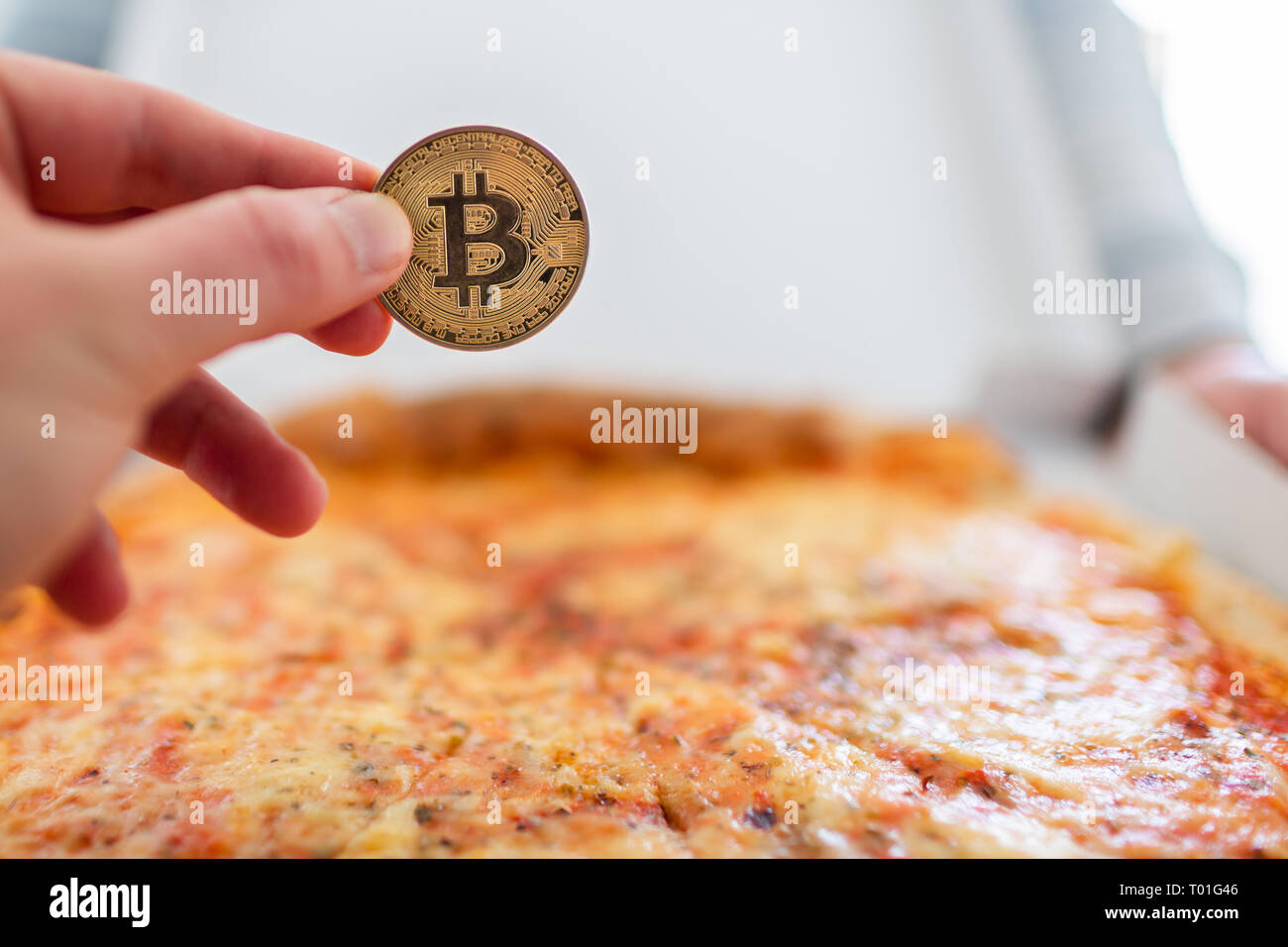 Bitcoin pizza day anniversary. The first reported exchange of cryptocurrency  for a consumer product on May 22, 2010 Stock Photo - Alamy
