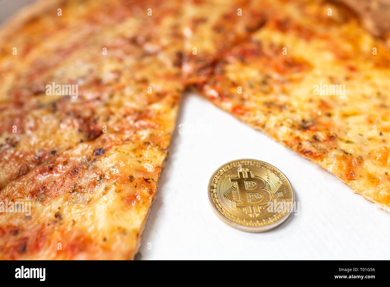 Bitcoin pizza day anniversary. The first reported exchange of cryptocurrency  for a consumer product on May 22, 2010 Stock Photo - Alamy
