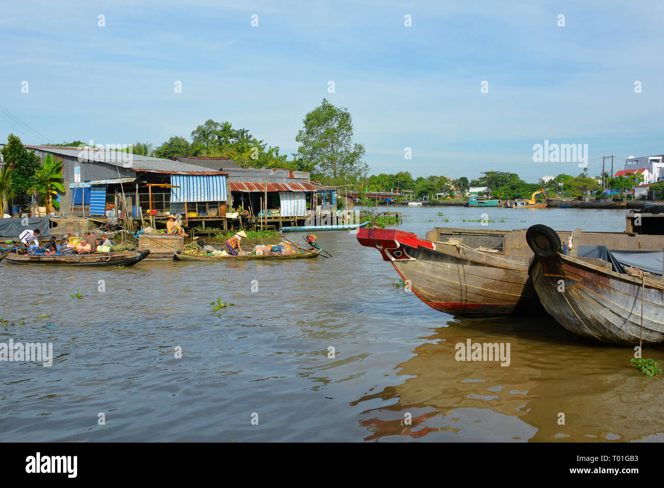 Phong Dien, Vietnam - December 31st 2017. The bows of two boats on the river at the Phong Dien Floating Market near Can Tho in the Mekong Delta Stock Photo