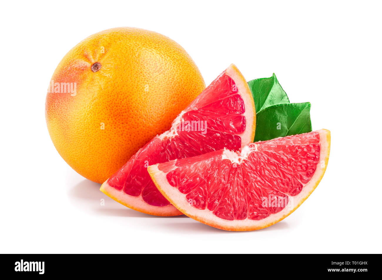 grapefruit and slice with leaves isolated on white background. Stock Photo