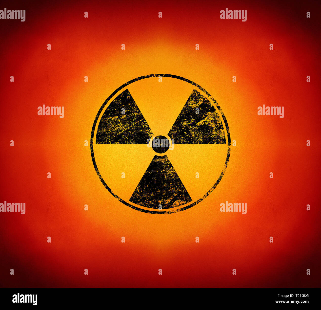 Black radioactive hazard warning sign painted over grunge yellow and red background with copy space Stock Photo