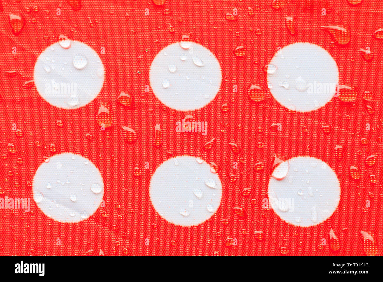 water drop on a waterproof fabric point Red and white beautiful background  with copy space Stock Photo