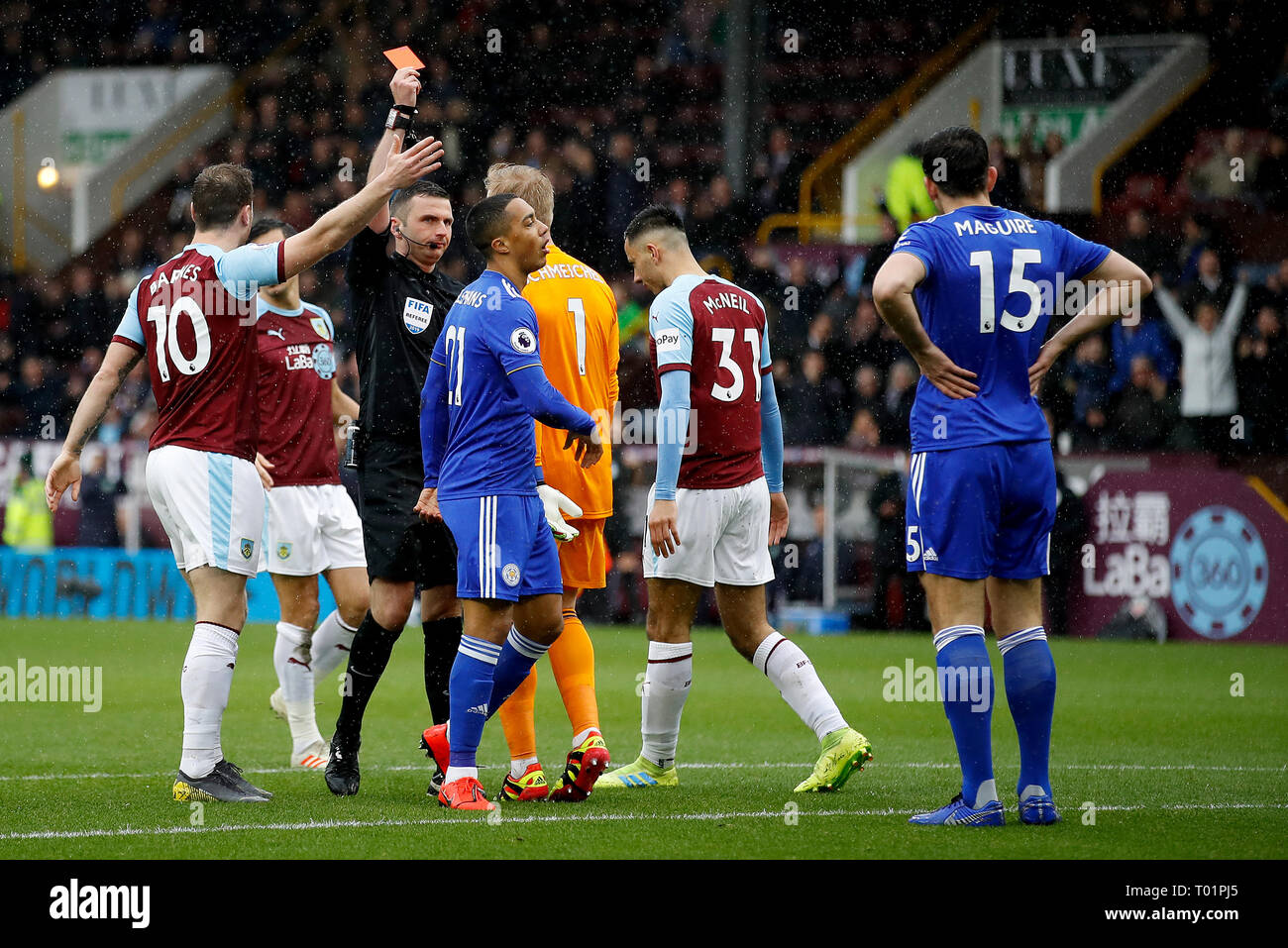 Leicester City's Harry Maguire (right) is sent-off by match referee Michael Oliver during the Premier League match at Turf Moor, Burnley. Stock Photo