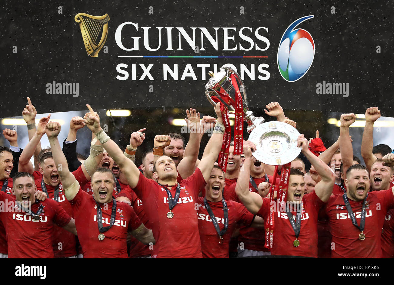 Wales lift the Six Nations Trophy and the Triple Crown trophy after the ...