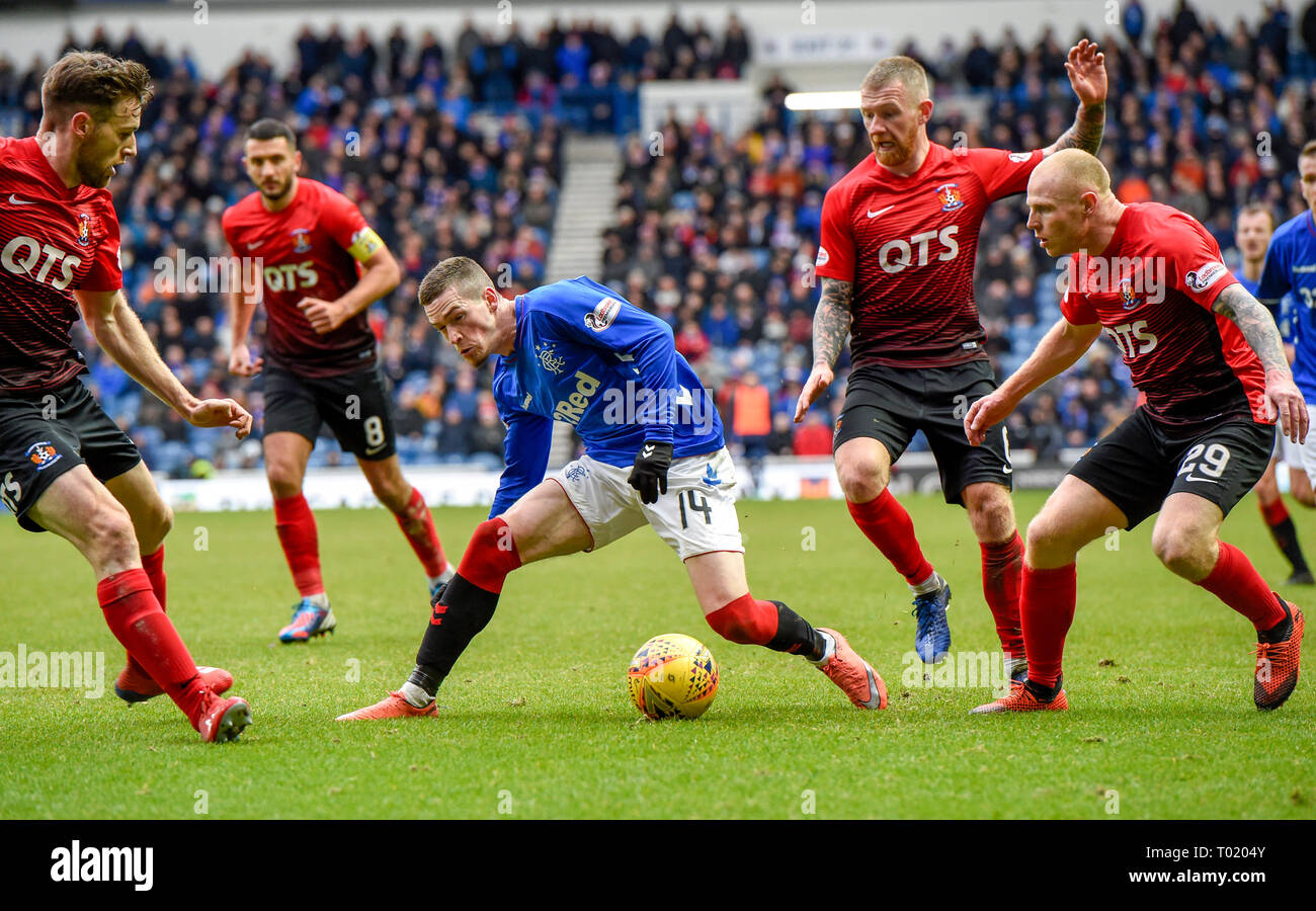 Rangers' Ryan Kent is surrounded by Kilmarnock players Stephen O'Donnell, Alan Power and Chris Burke during the Ladbrokes Scottish Premiership match at Ibrox Stadium, Glasgow. Stock Photo