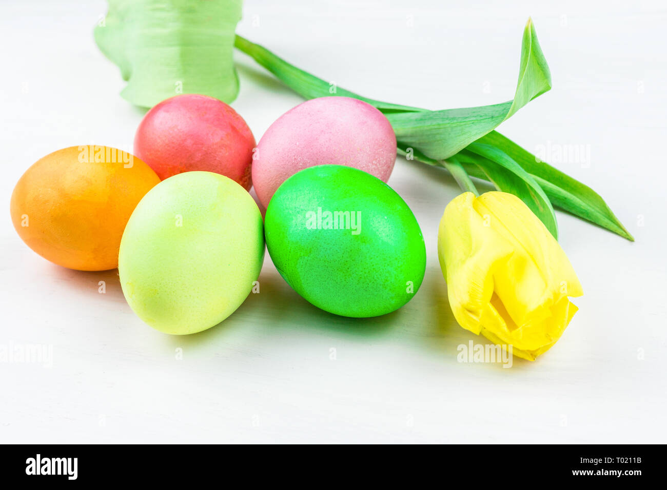 Easter eggs and a flower on a white background Stock Photo - Alamy