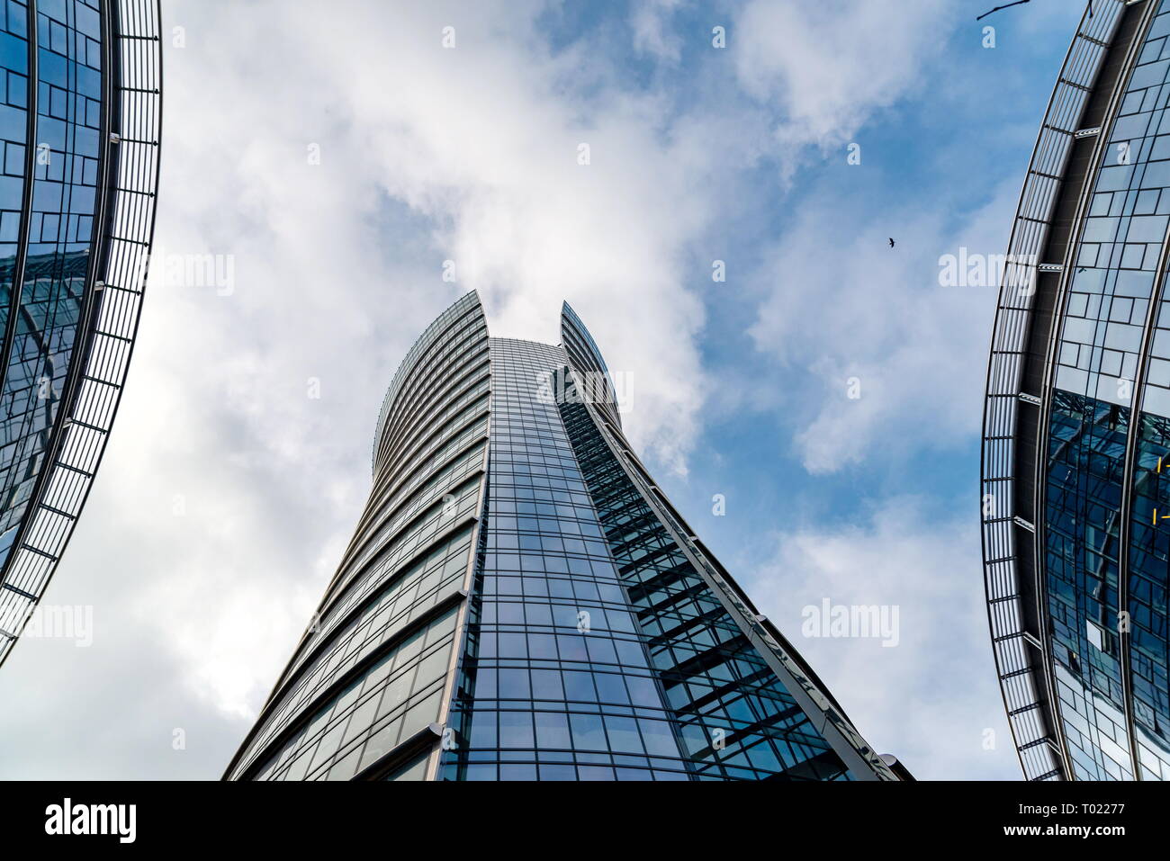 Glass skyscrapers of irregular shape. Bottom view. Abstract architectural detail of corporate building suitable as background Stock Photo