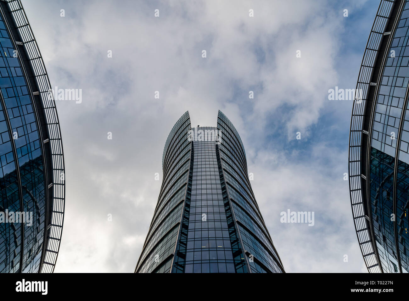 Glass skyscrapers of irregular shape. Bottom view. Abstract architectural detail of corporate building suitable as background Stock Photo