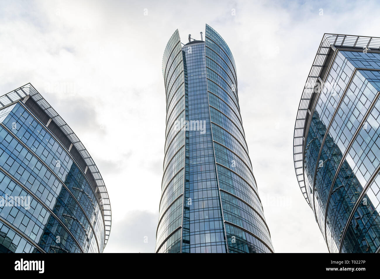 Glass skyscrapers of irregular shape. Bottom view. Abstract architectural detail of corporate building suitable as background Stock Photo