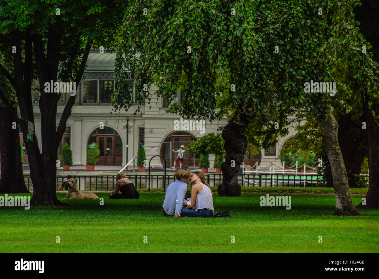 Budapest, Hungary, September , 13, 2019 - People kissing in a date at Varosliget park ina a sunny day Stock Photo