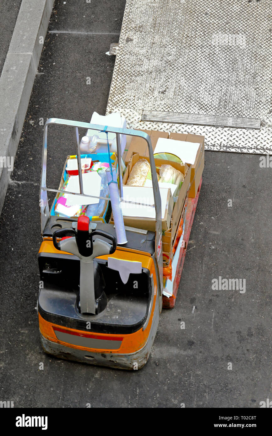 Forklift vehicle with goods for delivery at ramp Stock Photo - Alamy