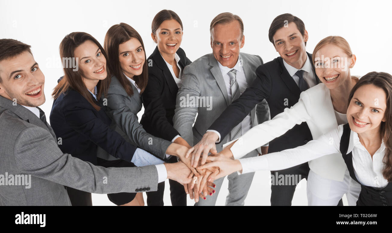 Business people group team hold pile hands, businesspeople putting