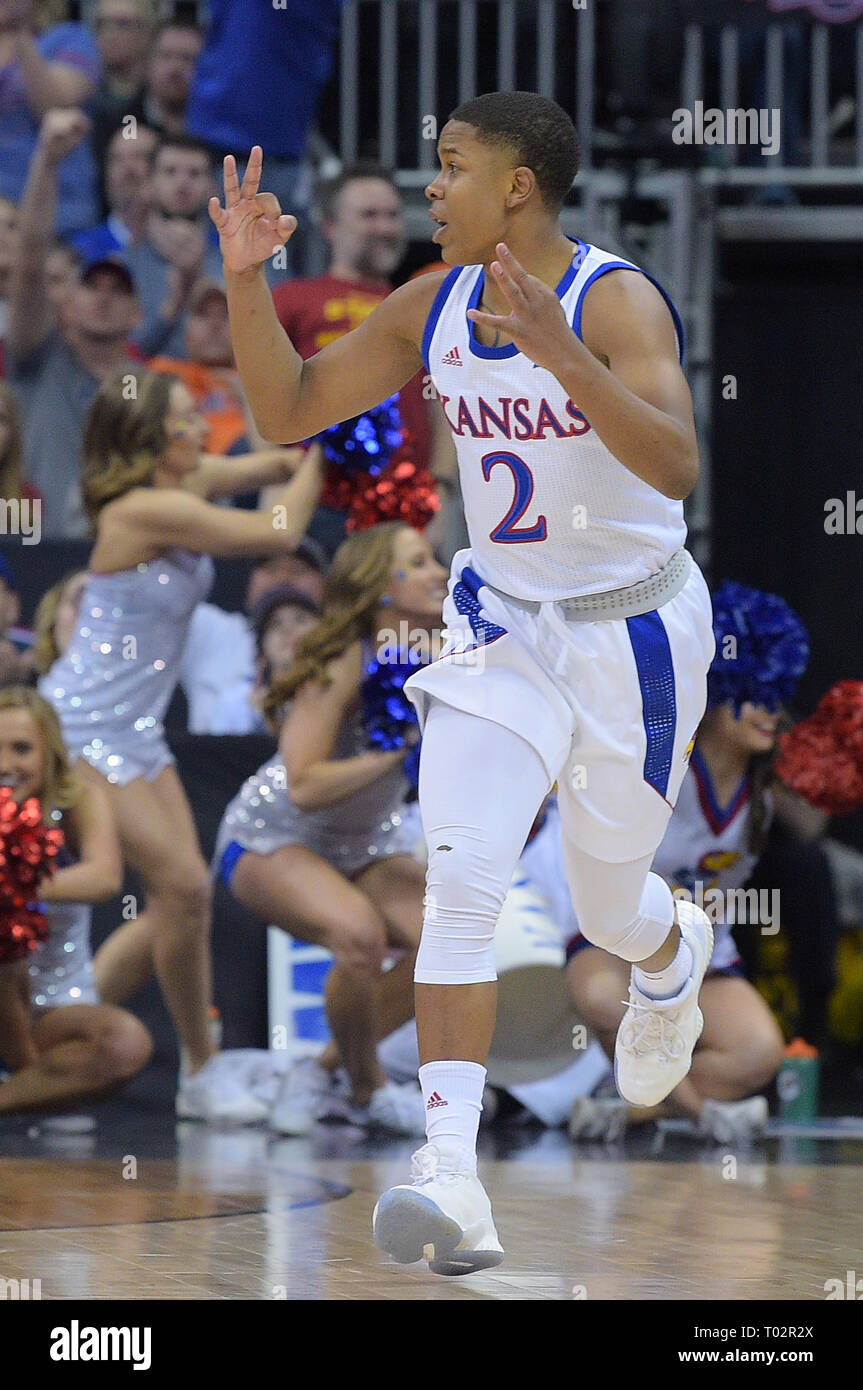 Kansas City, Missouri, USA. 16th Mar, 2019. Kansas Jayhawks guard Charlie Moore (2) reacts to his made three pointer during the Phillips 66 Big 12 Men's Basketball Championship Game between the Kansas Jayhawks and the Iowa State Cyclones at the Sprint Center in Kansas City, Missouri. Kendall Shaw/CSM/Alamy Live News Stock Photo
