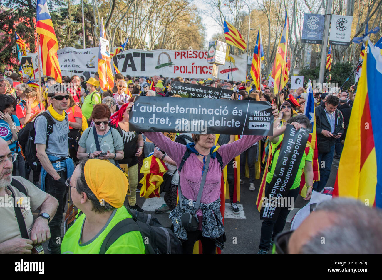 Madrid, Spain. 16th March 2019. A woman with a black placard ¨ self-determination is a right not a crime¨.  Thousands of independent catalonian people march in Madrid to renew and claim their rights to self-determination. Credit: Alberto Sibaja Ramírez/Alamy Live News Stock Photo