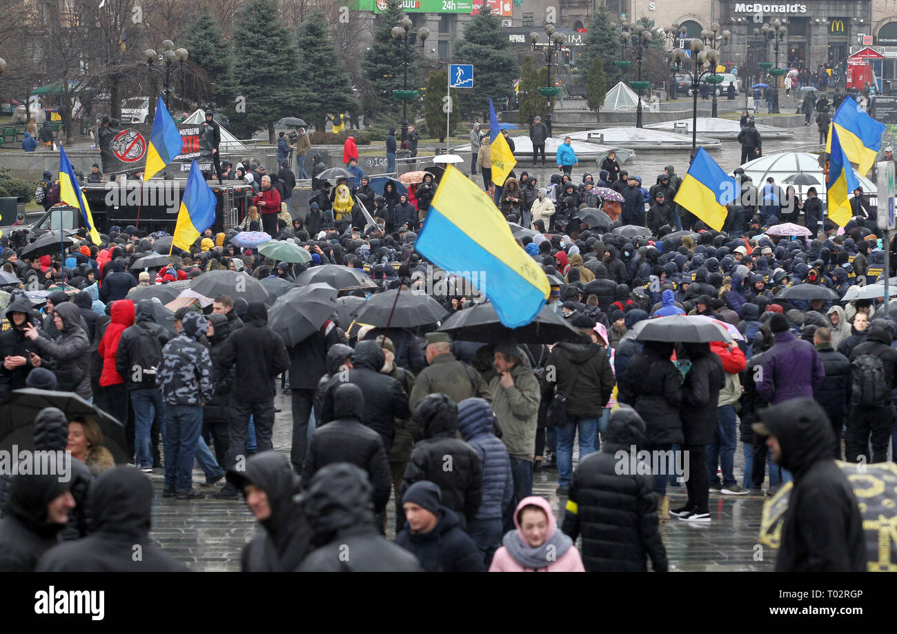Kiev, Ukraine. 16th March 2019. Nationalists are seen gathering outside the Presidential office during the protest. Protest against corruption in the country's defence industry in Kiev, Ukraine. Activists and supporters of 'National Corps' Ukrainian nationalist party demand for arrests of the top figures in an alleged military corruption scandal, which they were accused of profiting from the sale to state defence companies at inflated prices of smuggled Russian military parts. Credit: SOPA Images Limited/Alamy Live News Credit: SOPA Images Limited/Alamy Live News Stock Photo